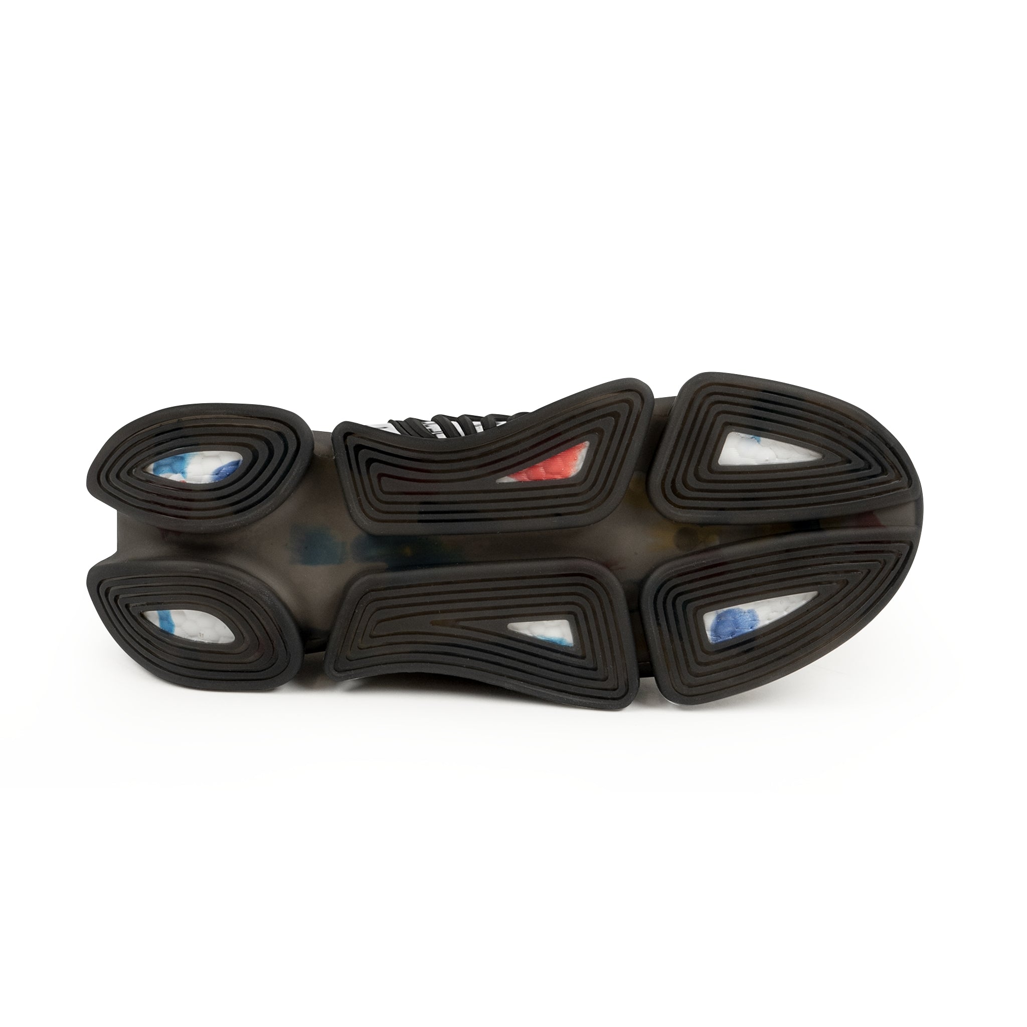 Close-up of a shoe sole with black rubber and multicolored accents on a white background