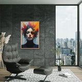 Modern living room with a black armchair, ottoman, and a colorful abstract painting on a gray wall.