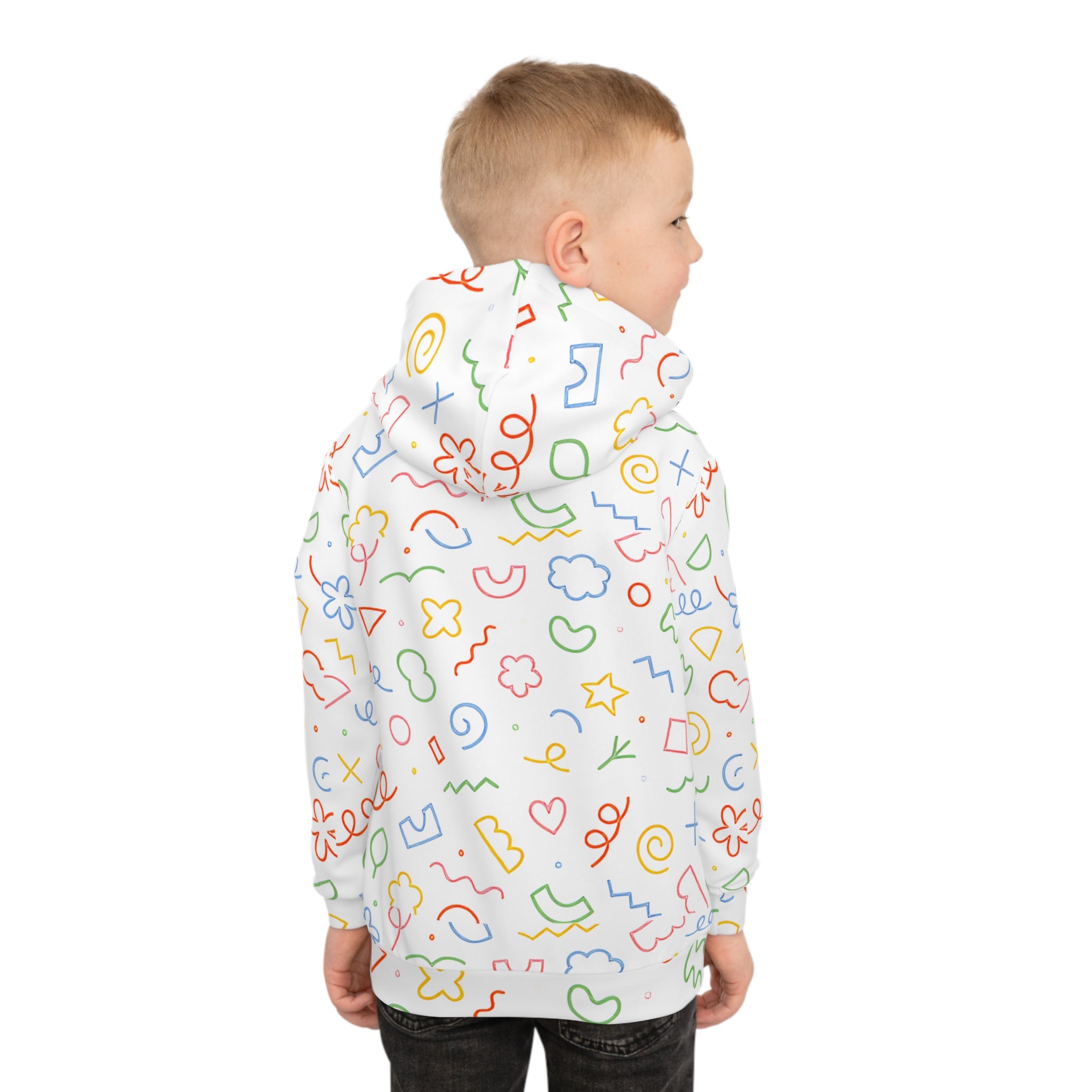 Child wearing a colorful patterned raincoat on a white background