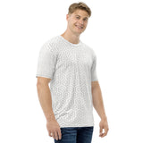 Man wearing a white t-shirt with a geometric pattern on a white background