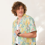 Person wearing a colorful floral shirt against a white background