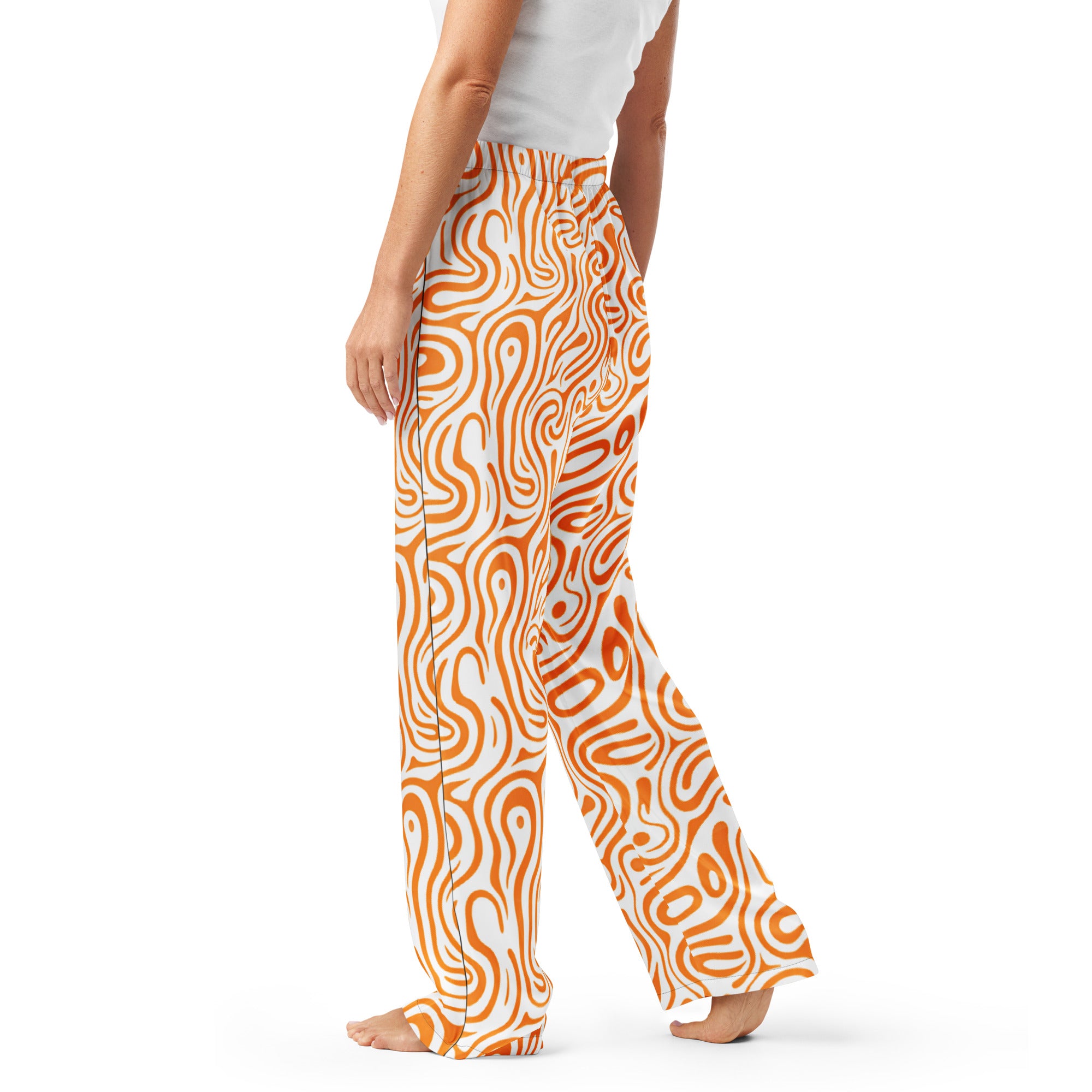 Orange and white patterned pants worn by a person on a white background
