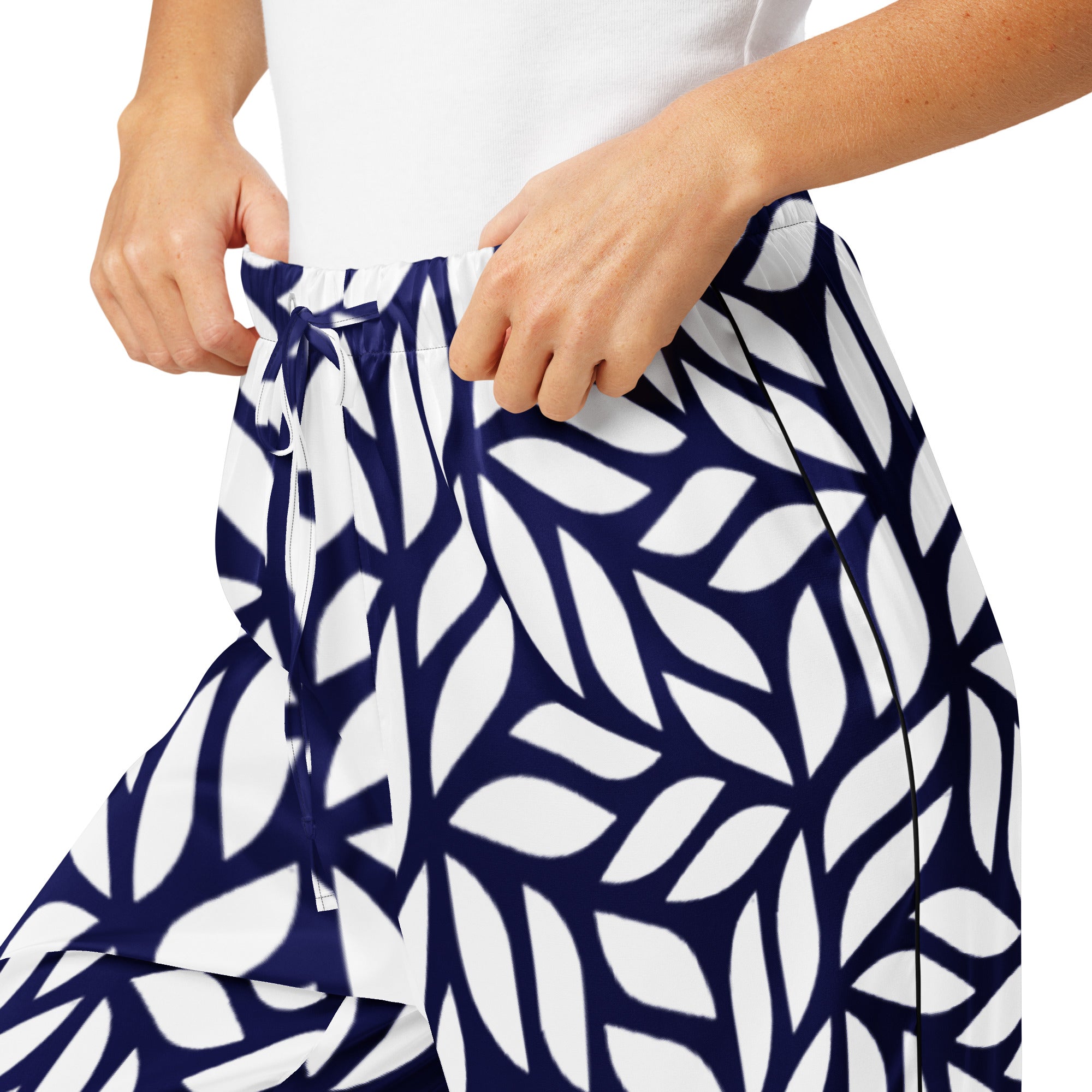 Person wearing a navy and white patterned skirt on a white background