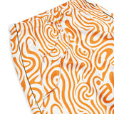 Orange and white patterned shorts on a white background