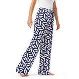 Navy and white patterned pants worn by a person on a white background