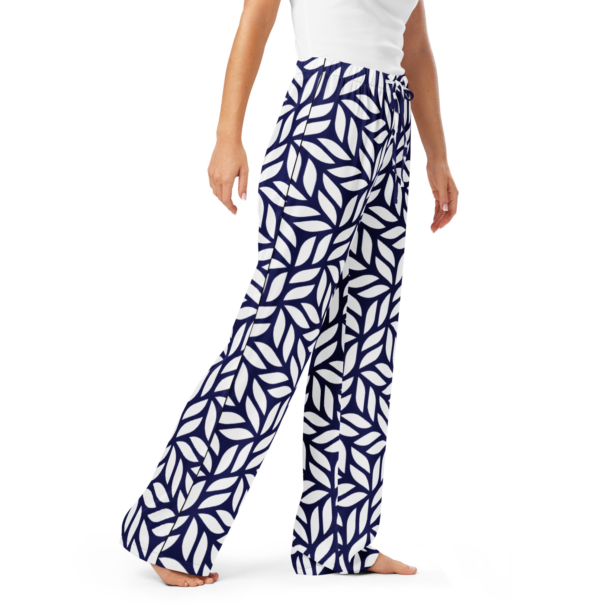 Navy and white patterned pants worn by a person on a white background