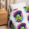 Bedding set with cartoon character design on a bed in a bedroom setting.