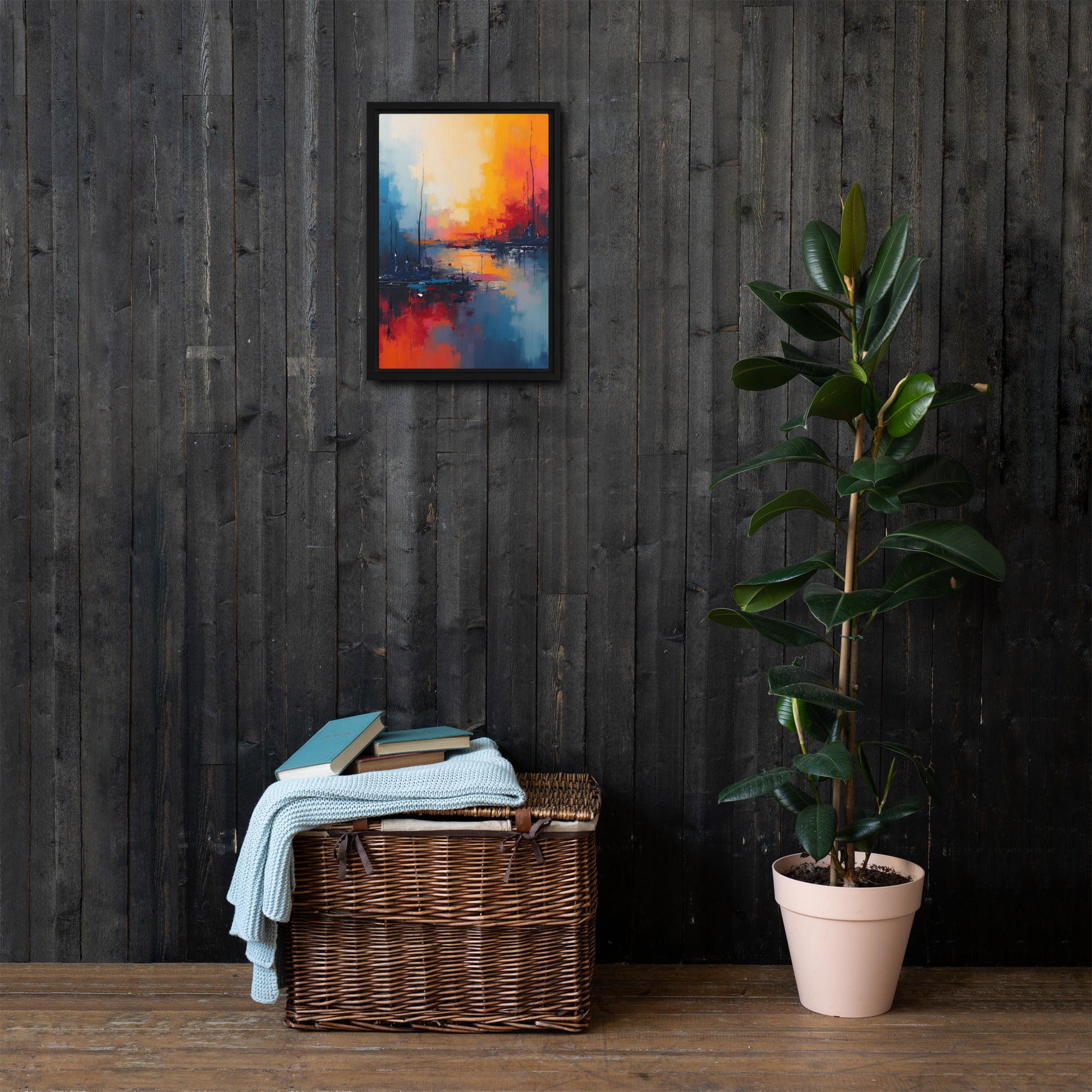 Framed abstract painting on a dark wooden wall with a wicker basket and plant below.