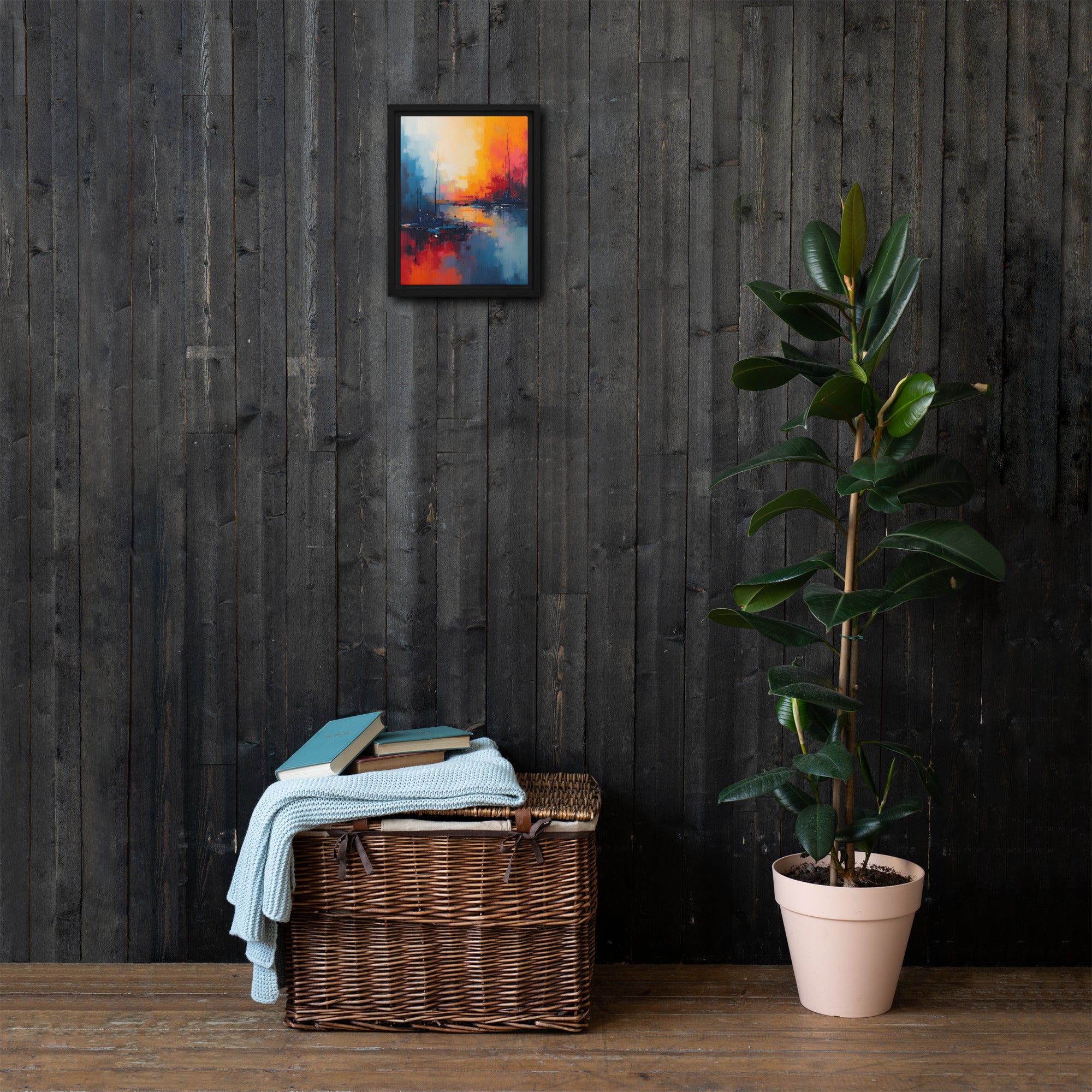 Wicker basket with towels and books against a dark wooden wall with a colorful abstract painting.