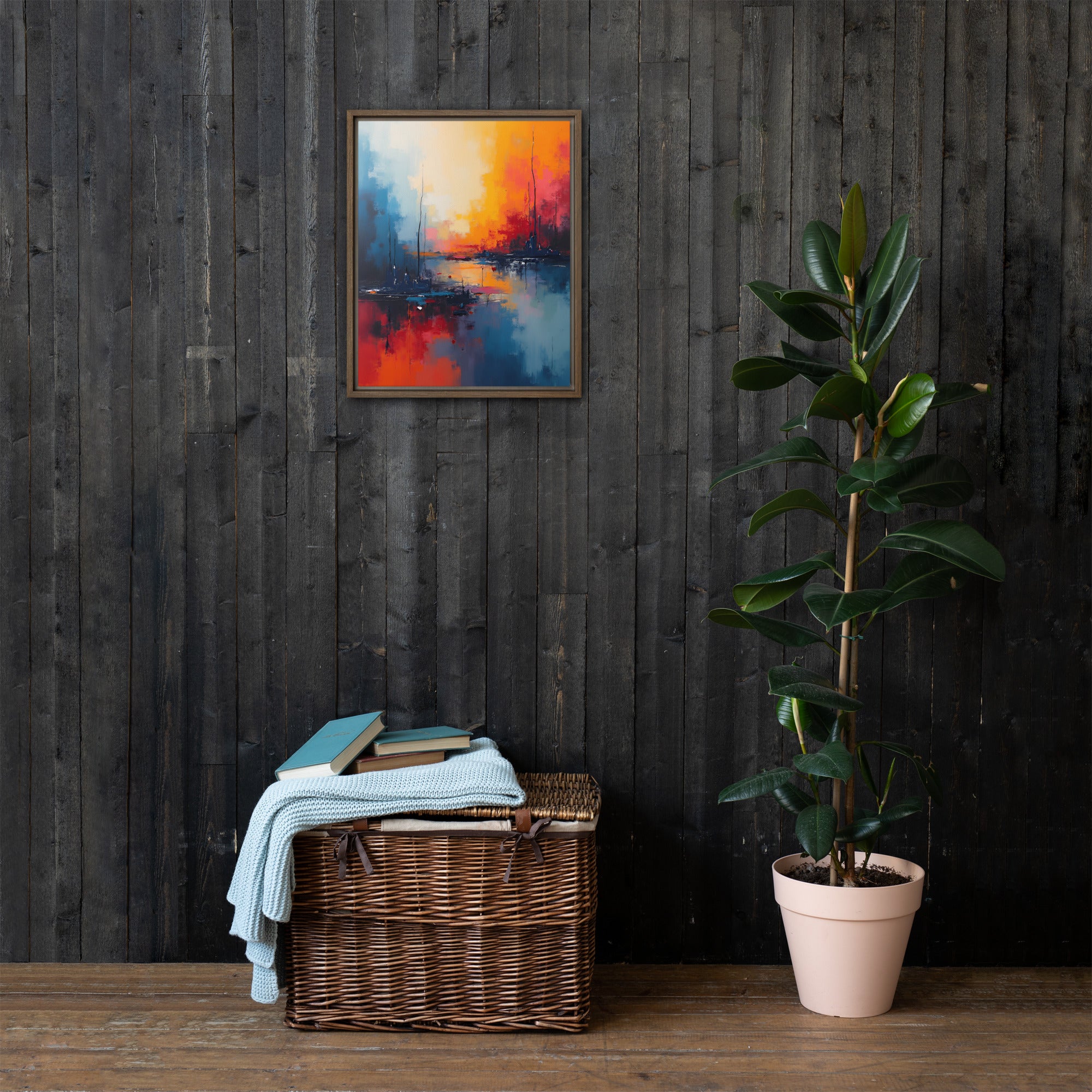 Framed abstract painting on a dark wooden wall with a wicker basket and plant below.