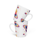 Two mugs with colorful planet designs stacked on a white background