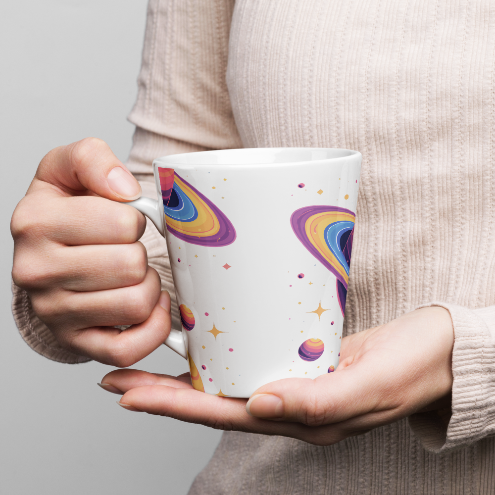 Person holding a mug with colorful designs on a plain background
