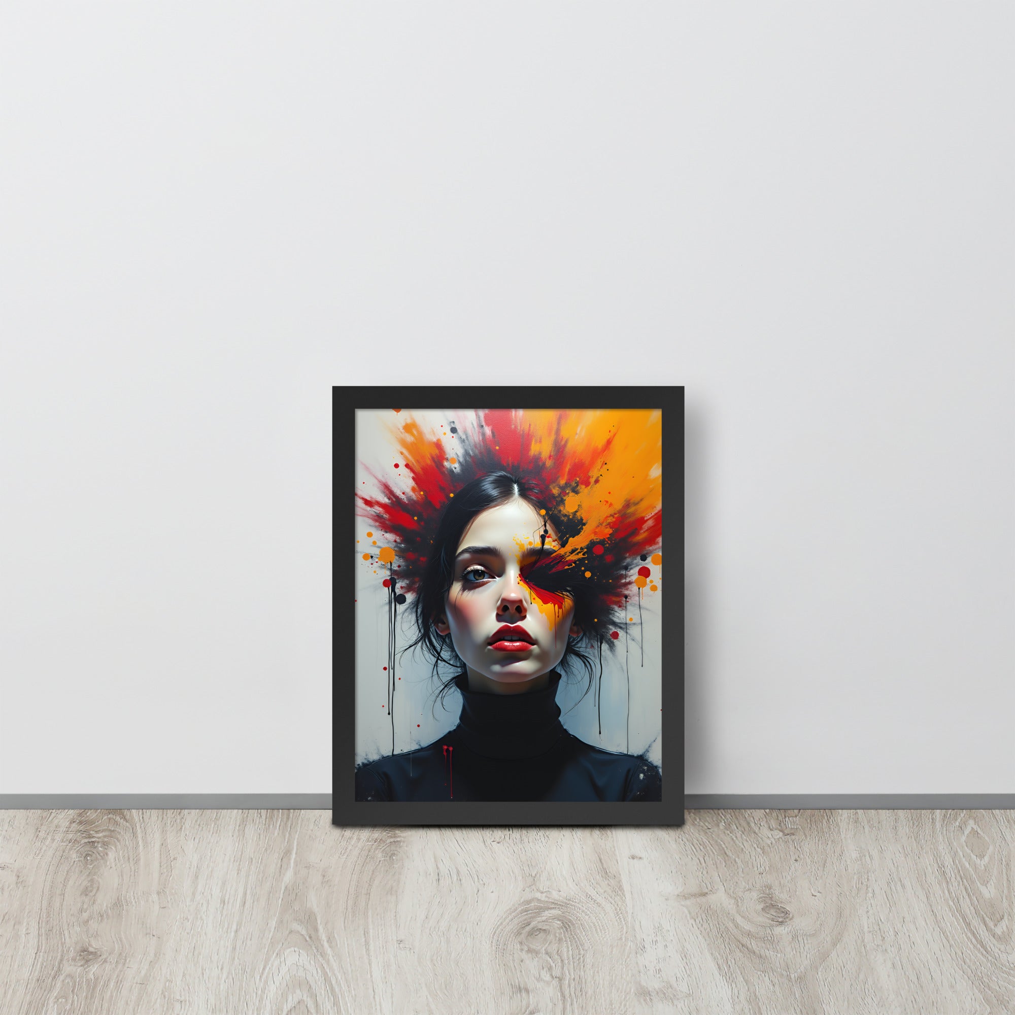 Framed artwork of a woman's face with colorful abstract design on a white wall.