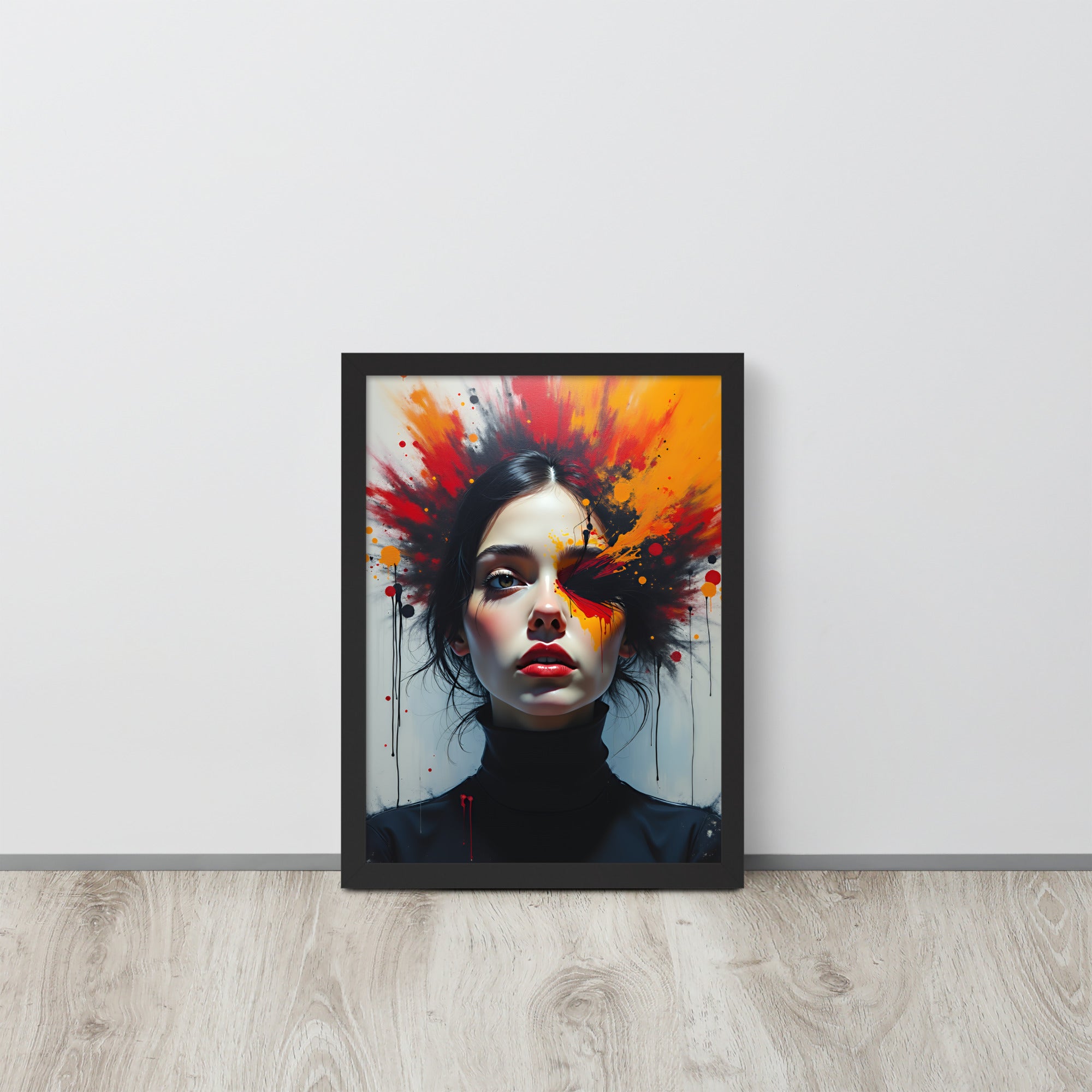 Framed artwork of a woman's face with colorful abstract design on a white wall.