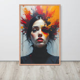 Framed artwork of a woman's face with colorful abstract design on a white wall.