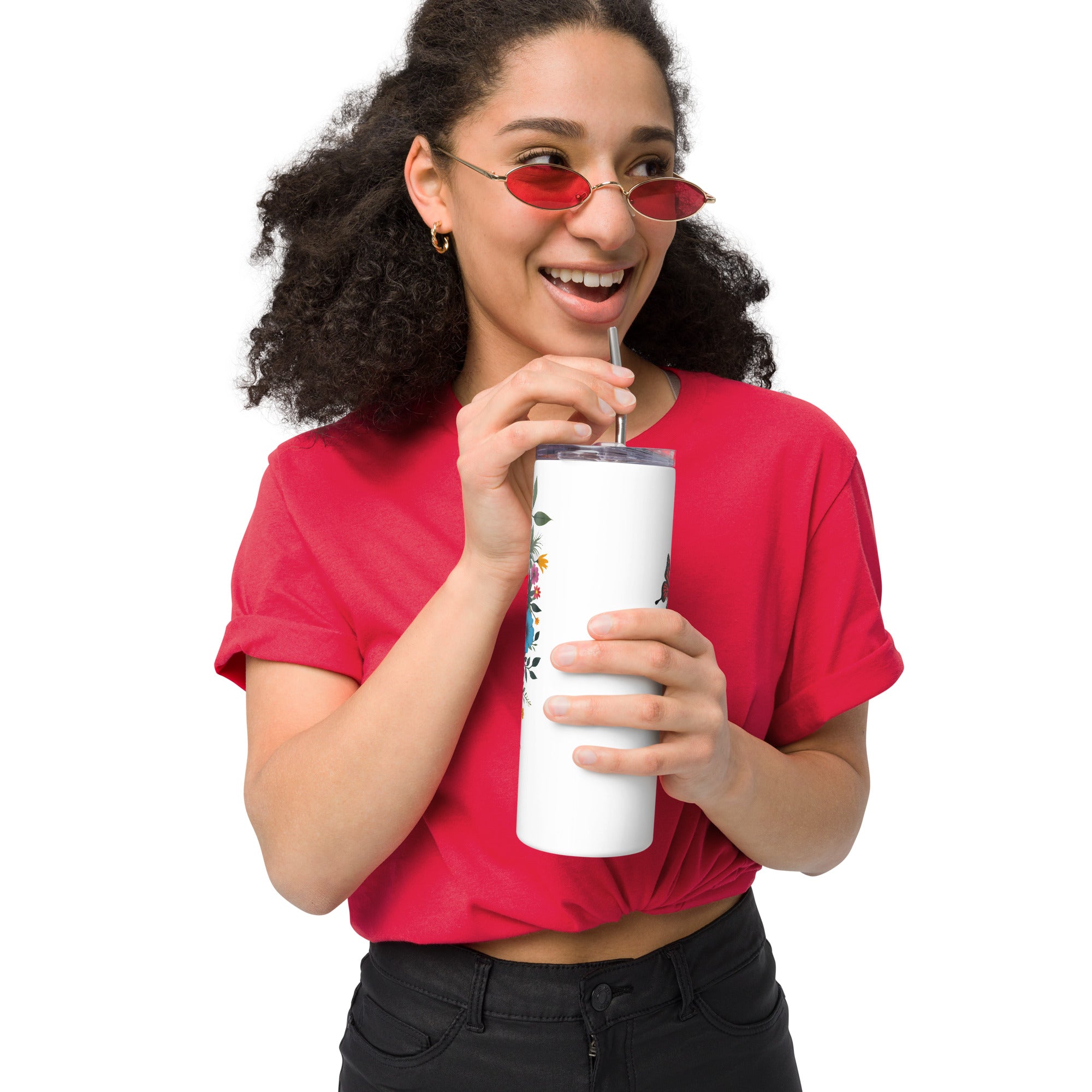 Person wearing a red shirt and sunglasses, holding a white tumbler with a logo.
