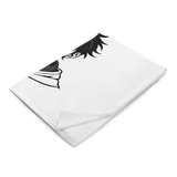 White towel with black eyelash design on a white background