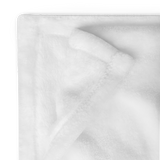 Close-up of white fabric with a subtle pattern on a white background