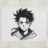 Fleece blanket with an anime character design on a wooden floor.