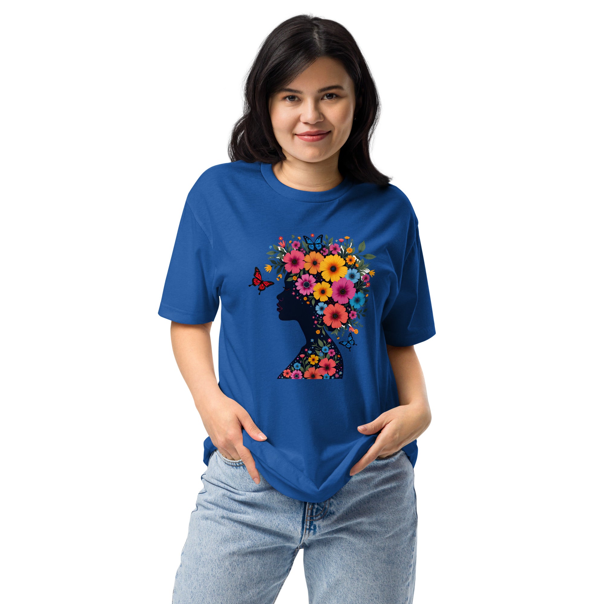 Person wearing a blue t-shirt with a colorful floral design on a white background