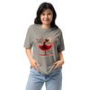 Person wearing a gray t-shirt with a graphic design of a dancer in a red dress on a white background