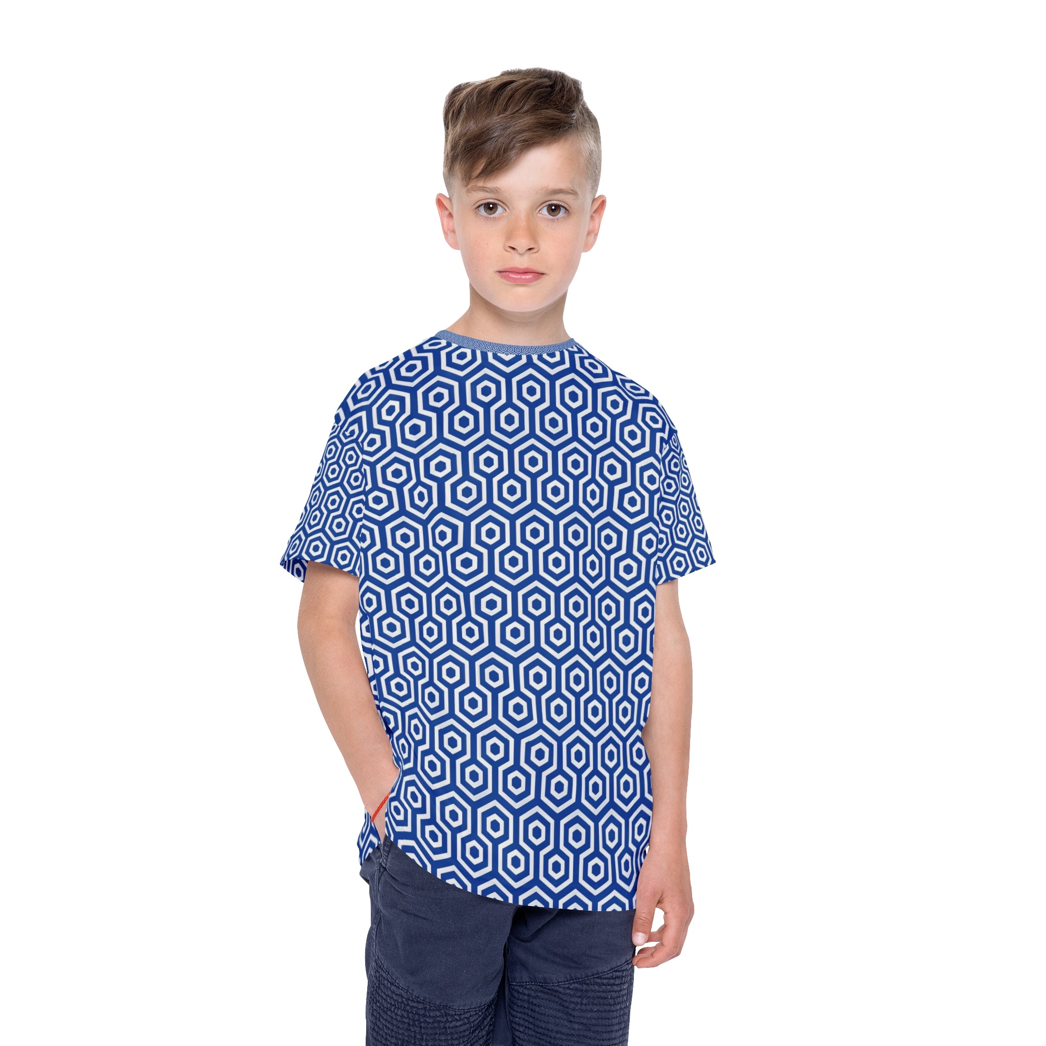 Child wearing a blue and white geometric patterned shirt on a white background