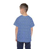 Child wearing a blue and white patterned shirt on a white background