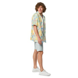 Man wearing a colorful floral shirt and light gray shorts on a white background