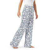 Light blue pajama pants worn by a person on a white background
