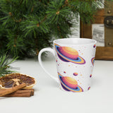 Mug with colorful planet design on a white surface with Christmas decorations.