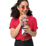 Person wearing a red shirt and sunglasses, holding a floral-patterned tumbler.