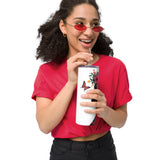 Person wearing a red shirt and sunglasses, holding a white tumbler with a floral design.